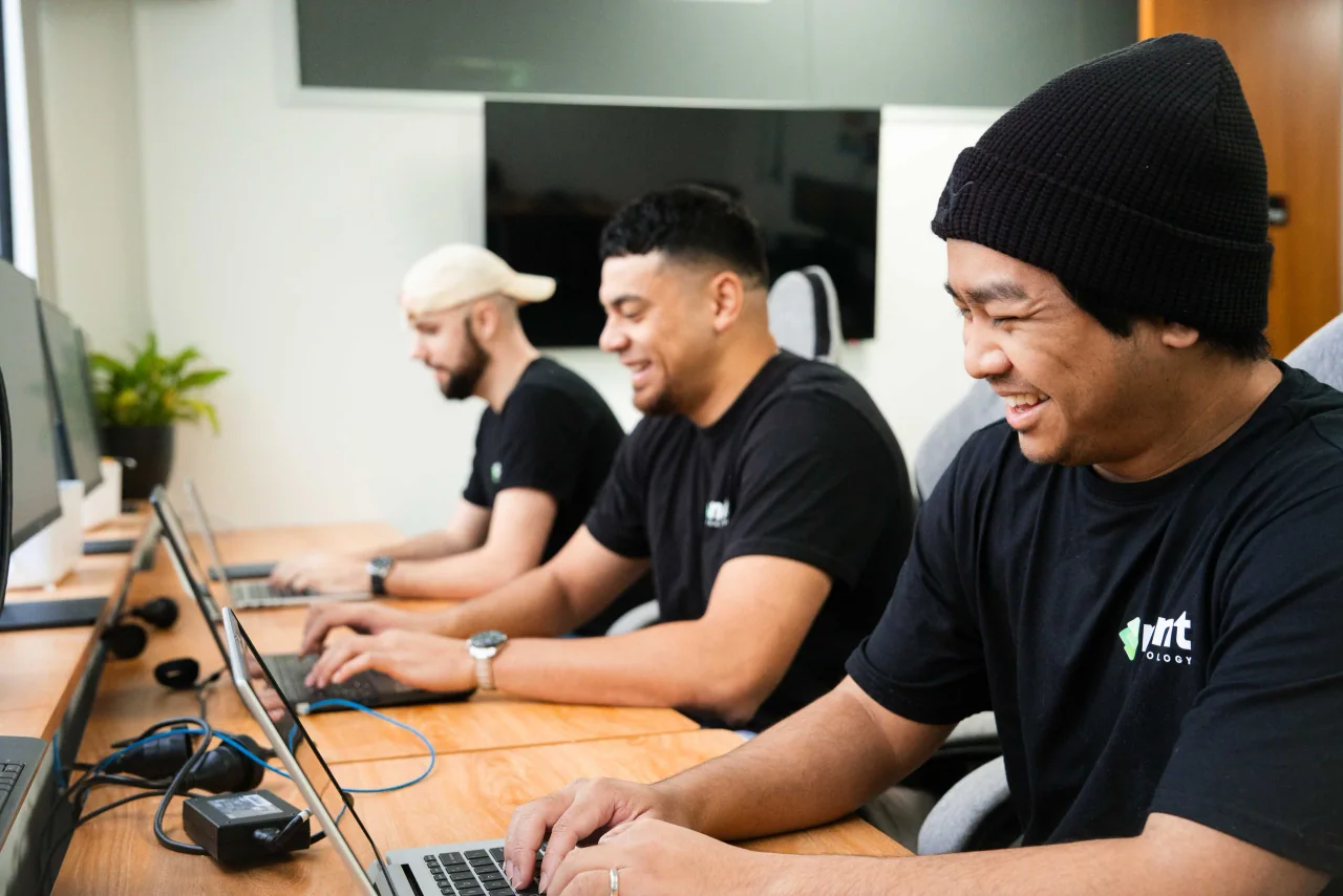 Mint technicians working at their laptops