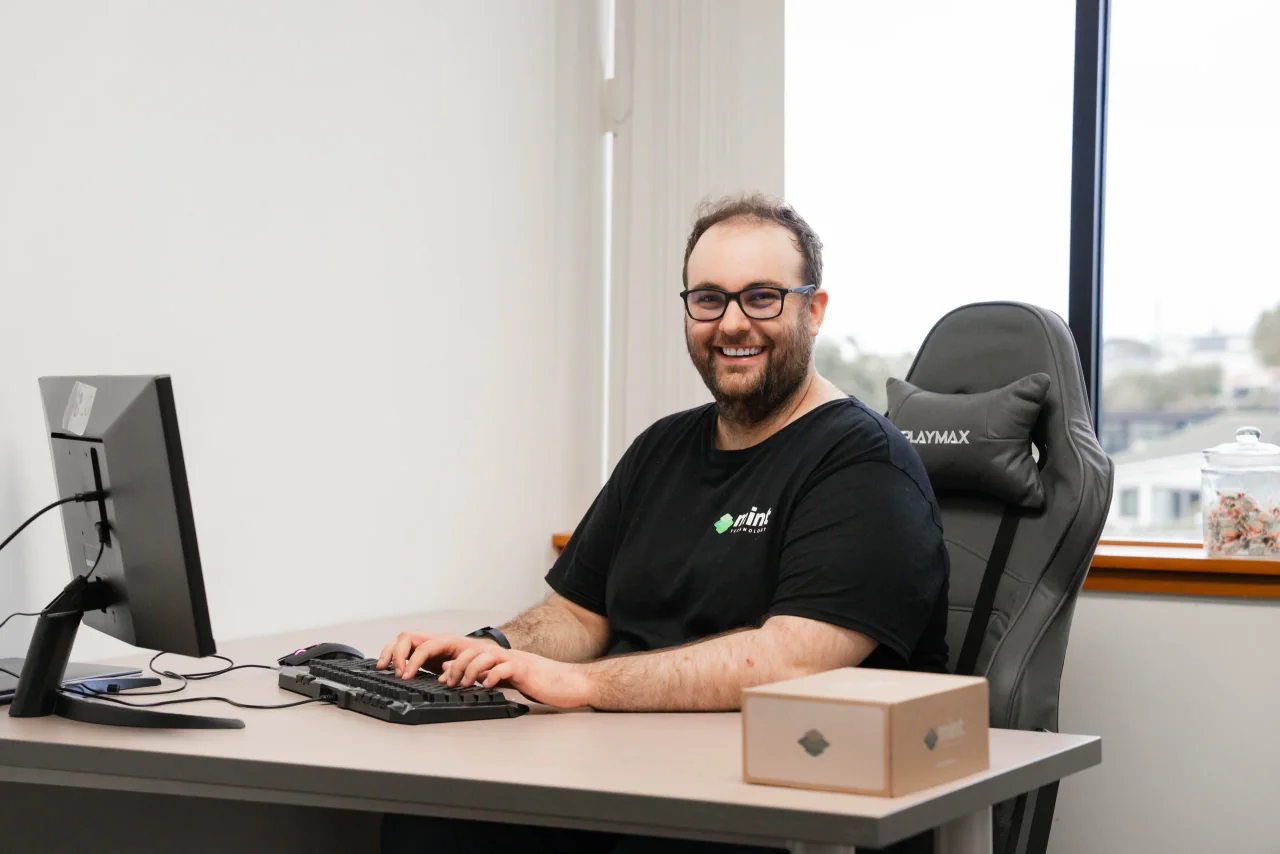 A Mint support technician at his desk