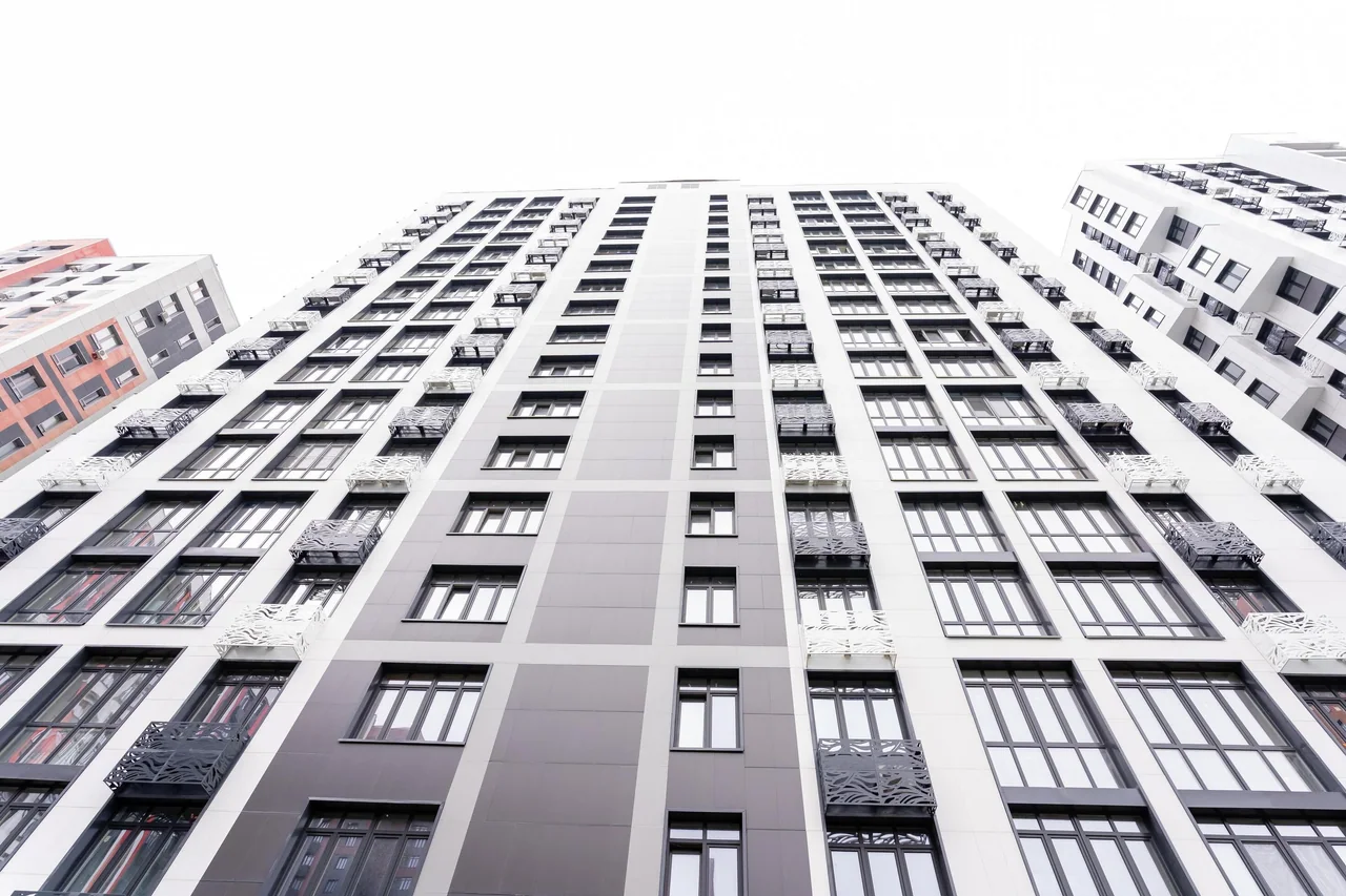 An apartment building seen from below