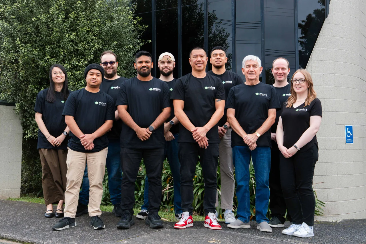 The Mint Technology team standing outside the Birkenhead office